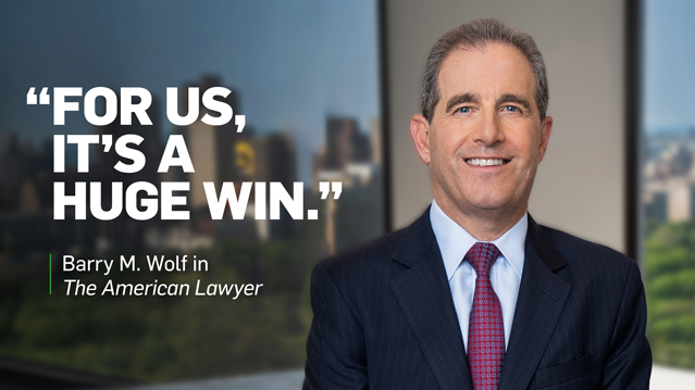 Quote graphic featuring Barry M. Wolf: "For us, it's a huge win," from The American Lawyer, with headshot and city skyline background