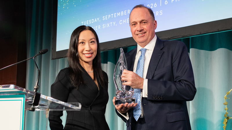 Jessica Liou presenting Gary Holtzer with the Tina Brozman Mentoring Award